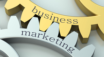 Interlocked gears displaying coupling of businesss and marketing